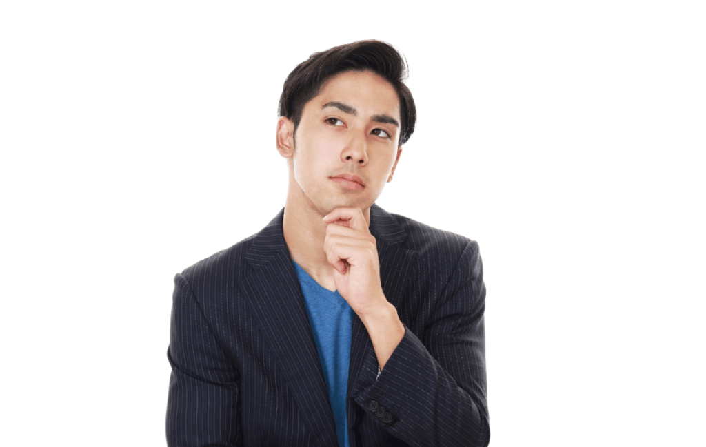 リピートが取れないと悩む40代の院長がサブスクを導入するか考えている姿